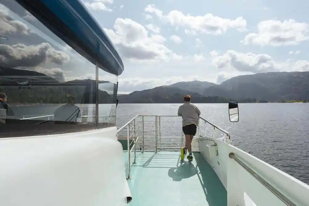 A passenger walking the empty sun deck