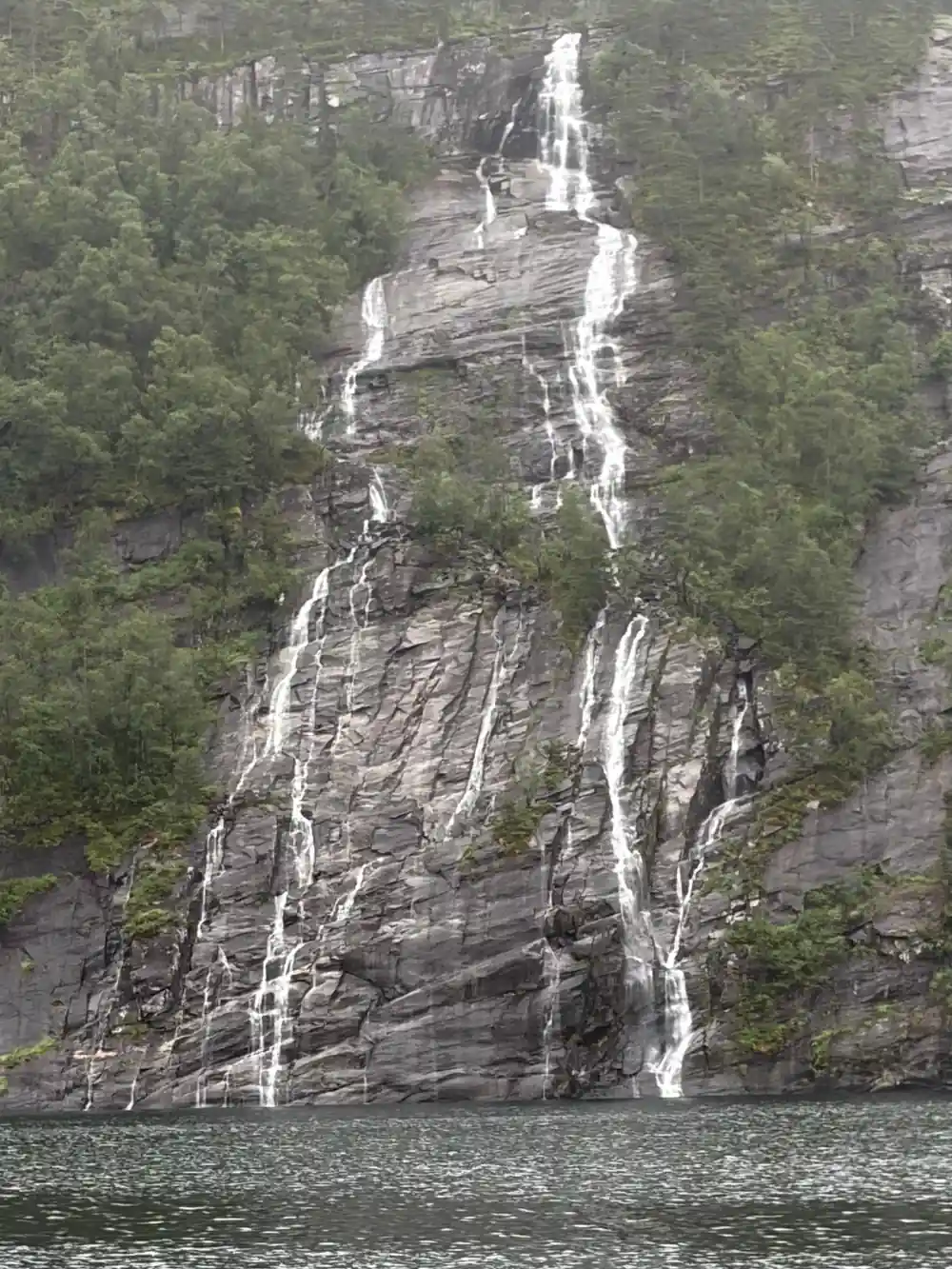 Twin waterfalls streaking a steep rock face